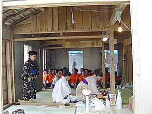           ()    - (. -)    (. ) (: .) // Priestesses making offerings inside MUTU (cult building) at Myaaku-zutsu harvest festival in Sarahama Town (September 2003), Irabu Island, Miyako  Islands  (Photo Evgeny BAKSHEEV).